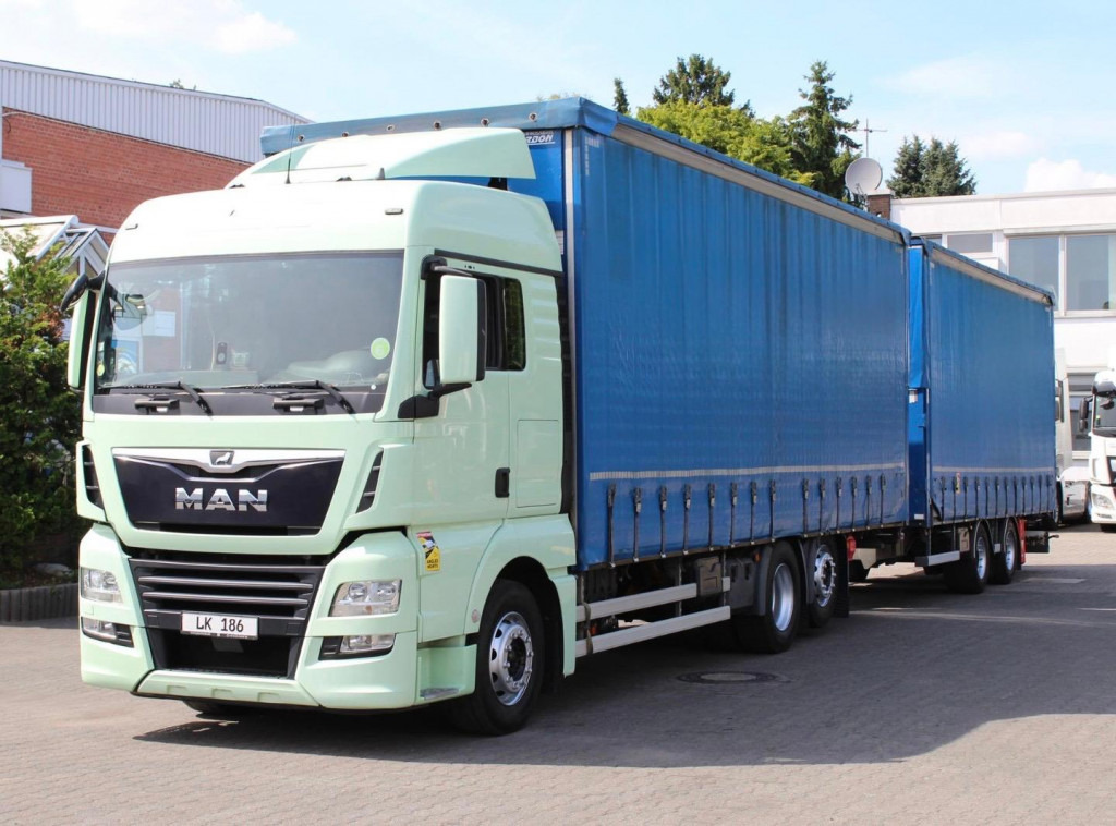 MAN TGX 26.460 Retarder Jumbo-Zug 120M3 Durchlade - Camión lona: foto 1 MAN TGX 26.460 Retarder Jumbo-Zug 120M3 Durchlade - Camión lona: foto 1
