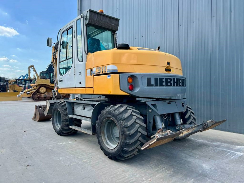 Liebherr A 311 Litronic - Excavadora de ruedas: foto 2 Liebherr A 311 Litronic - Excavadora de ruedas: foto 2