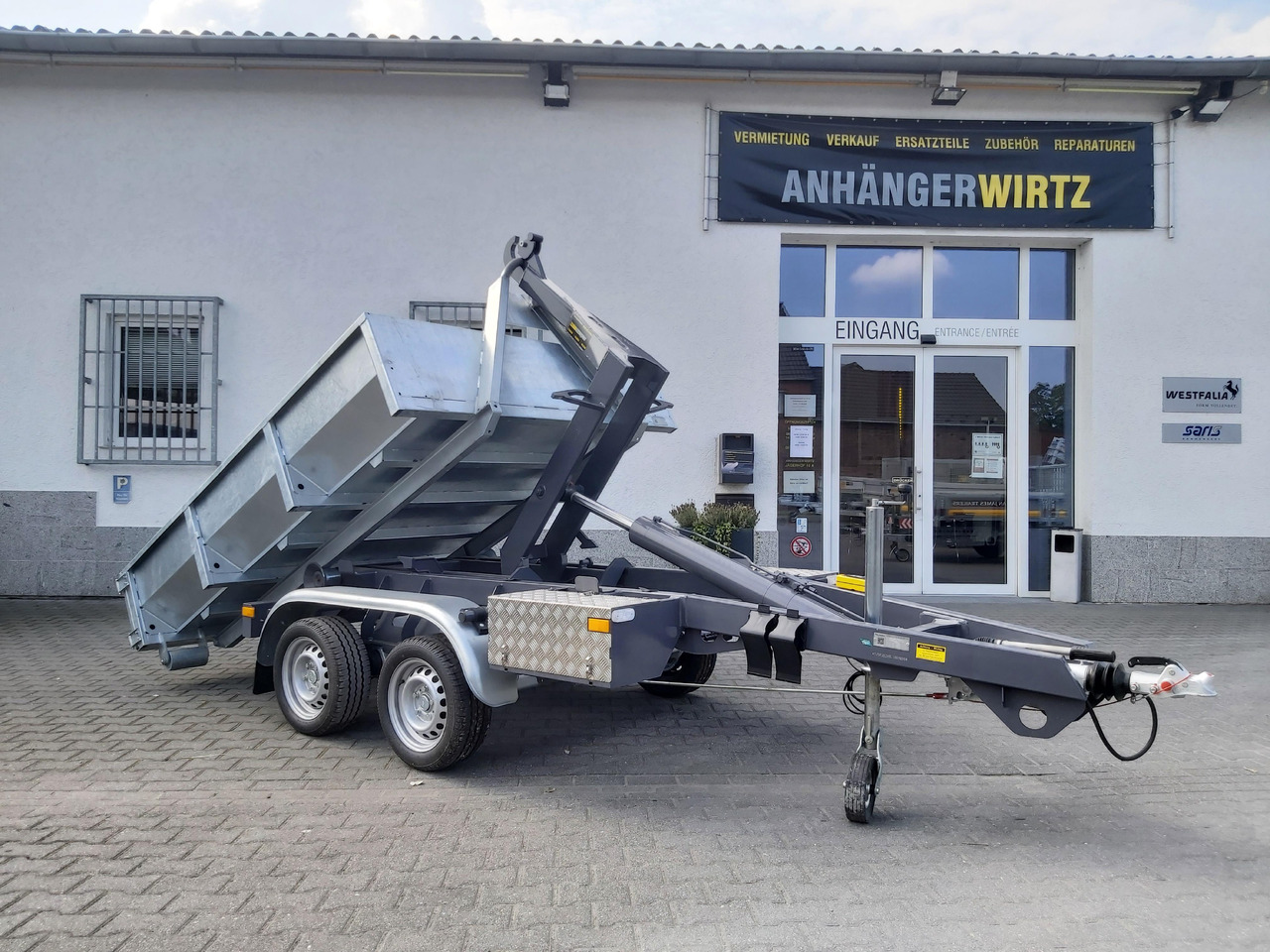 Hakenlift Anhänger Kipper KONOS 3500 elektro hydraulisch 3500kg mit Container Mulde - Remolque volquete: foto 1 Hakenlift Anhänger Kipper KONOS 3500 elektro hydraulisch 3500kg mit Container Mulde - Remolque volquete: foto 1