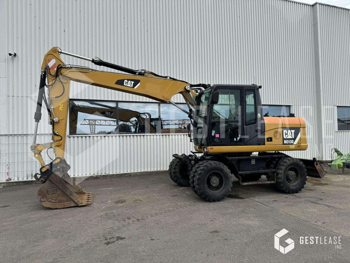 Caterpillar M313D - Excavadora de ruedas: foto 1 Caterpillar M313D - Excavadora de ruedas: foto 1