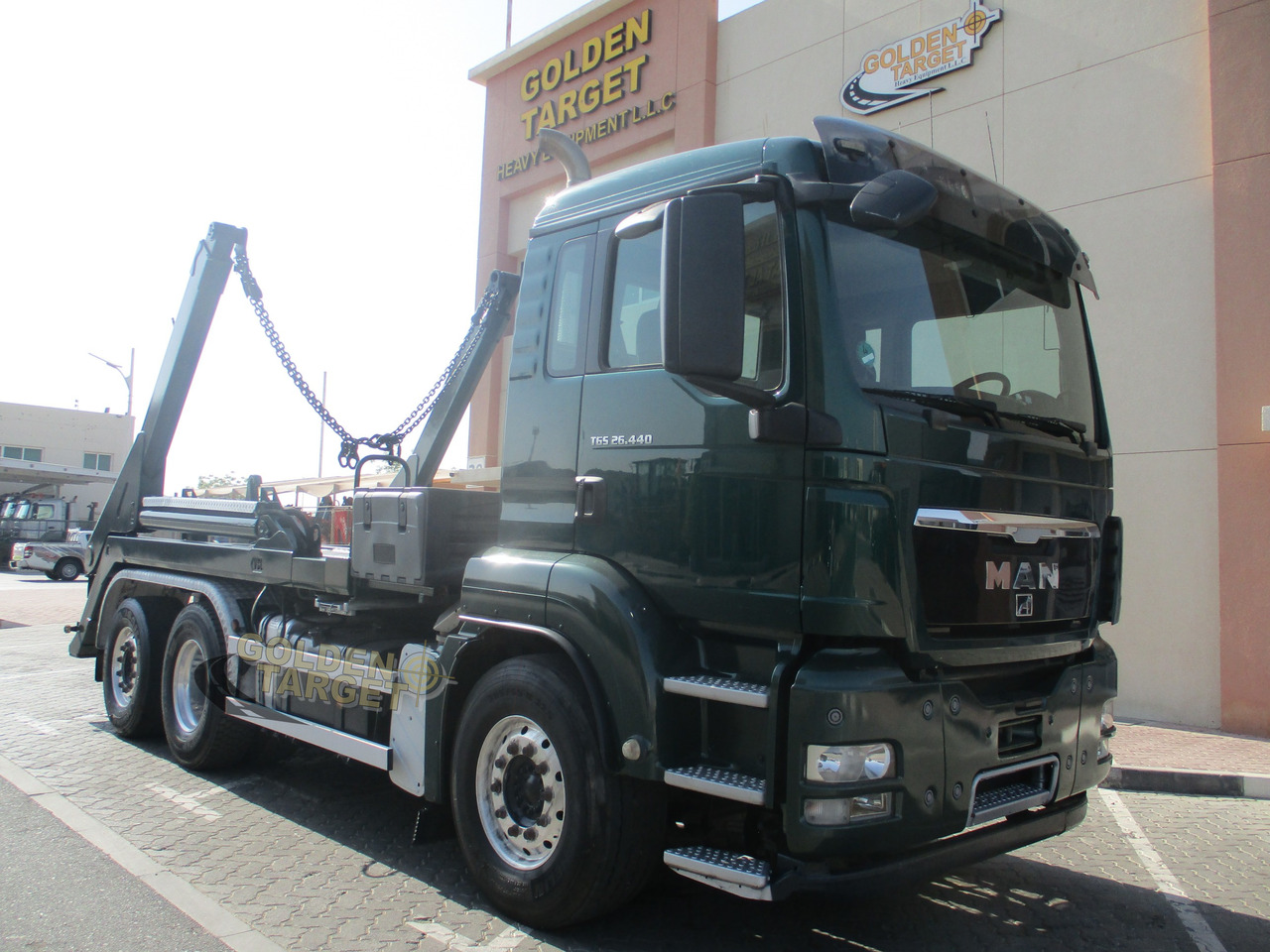 MAN TGS 26.440 6x2 Skip Loader - Camión portacontenedor de cadenas: foto 1 MAN TGS 26.440 6x2 Skip Loader - Camión portacontenedor de cadenas: foto 1