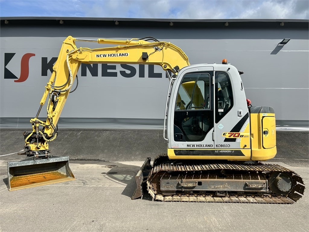 New Holland E 70BSR 2D MITTALAITTEET - Miniexcavadora: foto 1 New Holland E 70BSR 2D MITTALAITTEET - Miniexcavadora: foto 1
