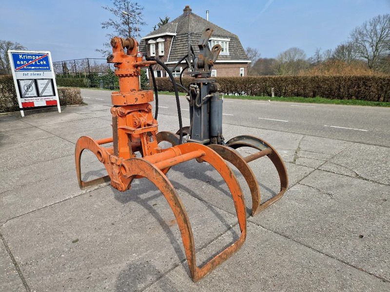 O & K en Atlas hydraulische bomenklemmen - Pinza de manipulación para Maquinaria forestal: foto 1 O & K en Atlas hydraulische bomenklemmen - Pinza de manipulación para Maquinaria forestal: foto 1