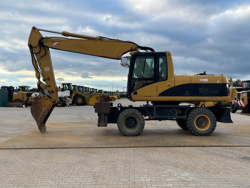 Caterpillar M318C - Excavadora de ruedas: foto 1 Caterpillar M318C - Excavadora de ruedas: foto 1