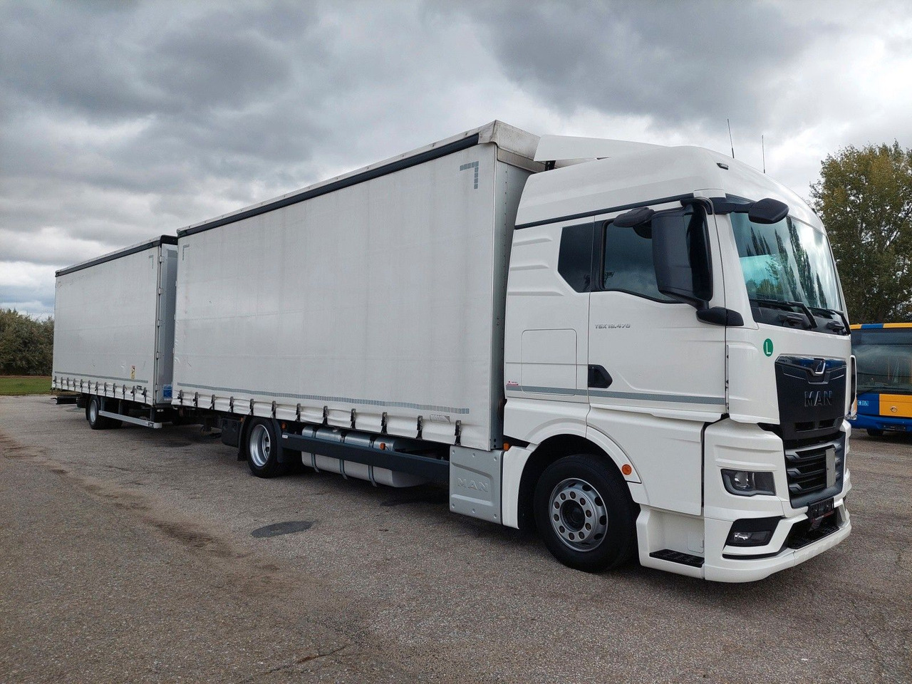 MAN TGX 18.470 LL + Gniotpol G-4080 120 m3 Durchbar - Camión lona: foto 2 MAN TGX 18.470 LL + Gniotpol G-4080 120 m3 Durchbar - Camión lona: foto 2
