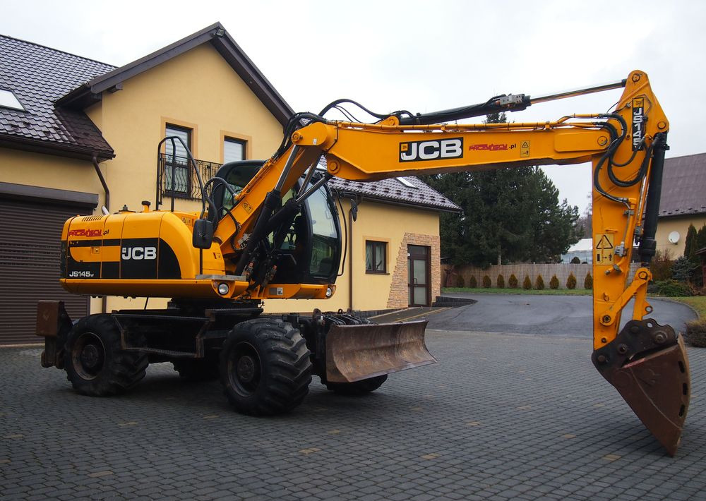 Koparka kołowa JCB JS145W 2011 Koparka JCB - Excavadora de ruedas: foto 1 Koparka kołowa JCB JS145W 2011 Koparka JCB - Excavadora de ruedas: foto 1