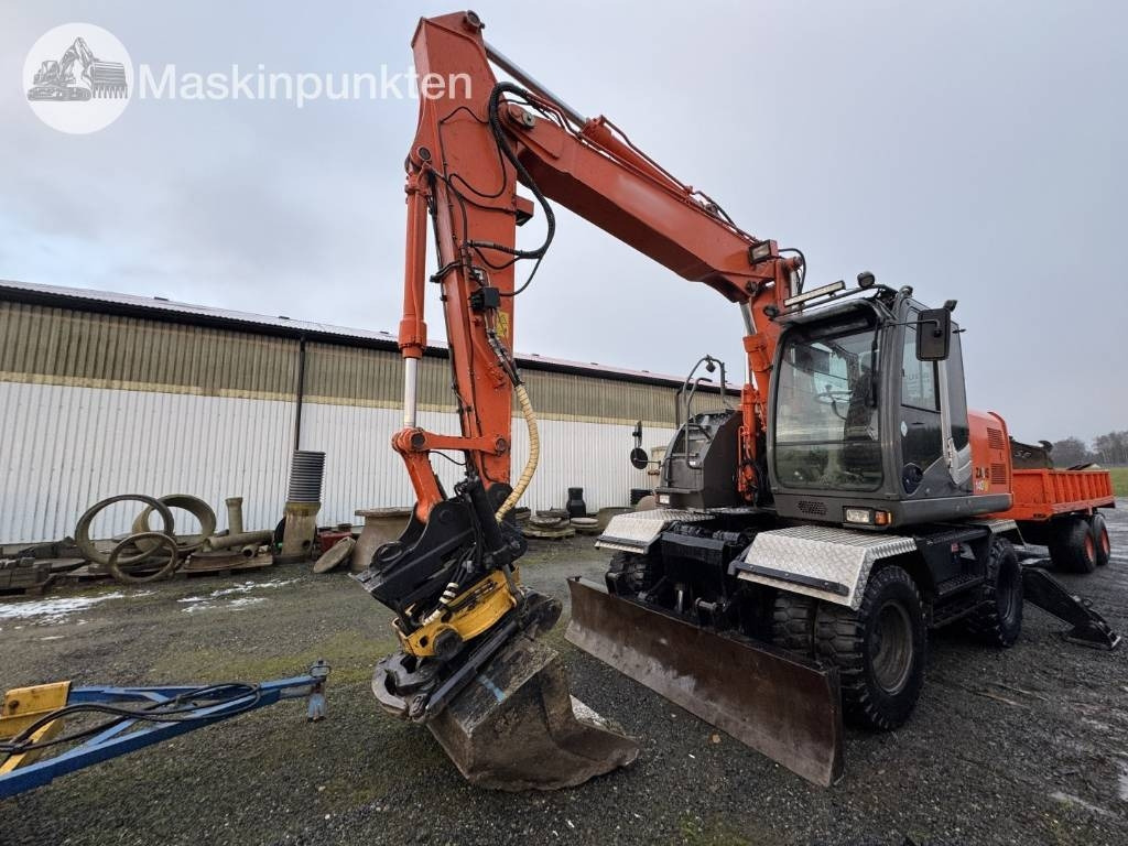 Hitachi ZX 140 W-3 Med vagn och redskap! - Excavadora de ruedas: foto 1 Hitachi ZX 140 W-3 Med vagn och redskap! - Excavadora de ruedas: foto 1