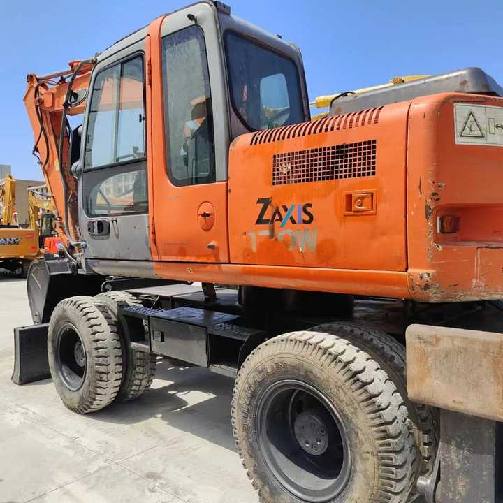 Used Japan Original Brand Hitachi Zx 130w Wheel Excavator Hitachi Zx120 130 200 Excavator for Sale - Excavadora de ruedas: foto 5 Used Japan Original Brand Hitachi Zx 130w Wheel Excavator Hitachi Zx120 130 200 Excavator for Sale - Excavadora de ruedas: foto 5