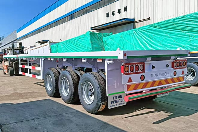 TITAN 3 Axle 40 Ft Flatbed Trailer for Sale in Mauritania - Semirremolque plataforma/ Caja abierta: foto 1 TITAN 3 Axle 40 Ft Flatbed Trailer for Sale in Mauritania - Semirremolque plataforma/ Caja abierta: foto 1