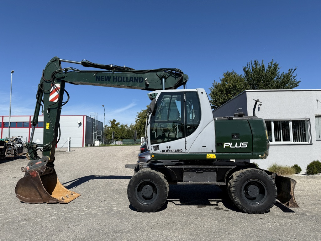 New Holland MH-Plus (111695) - Excavadora de ruedas: foto 1 New Holland MH-Plus (111695) - Excavadora de ruedas: foto 1