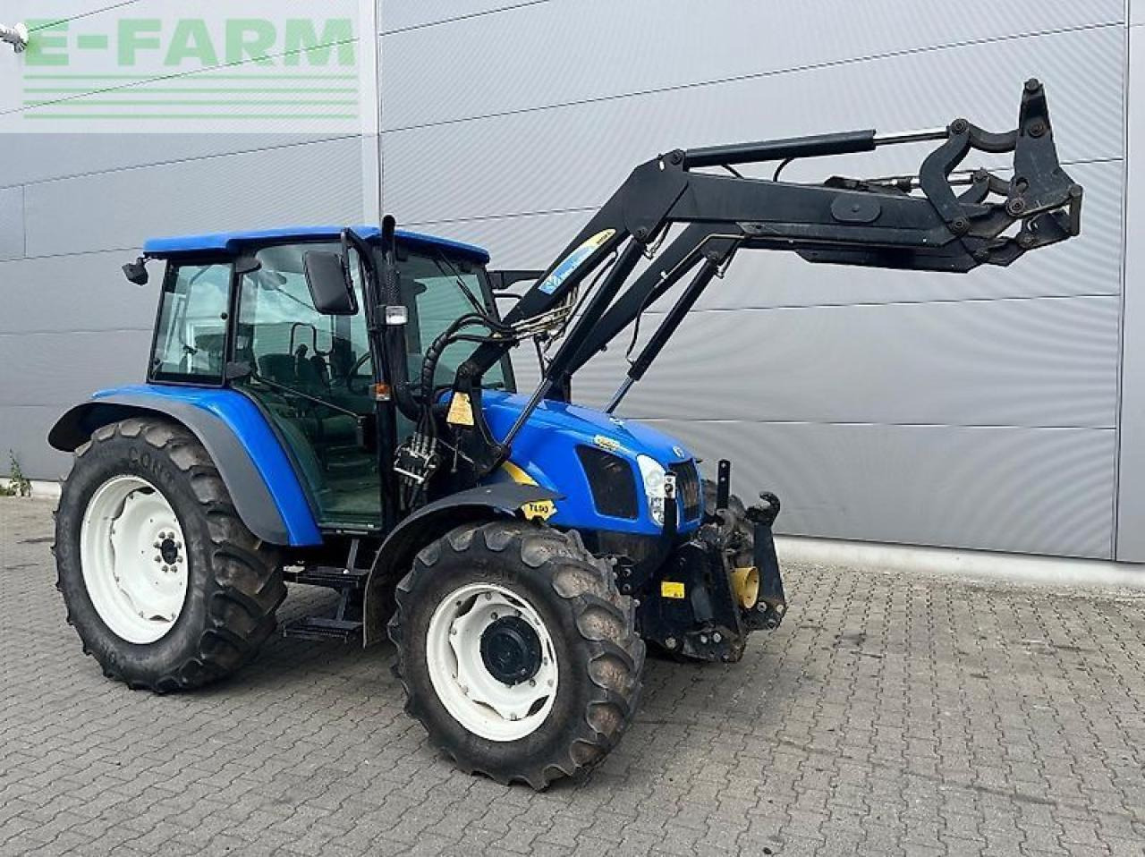 New Holland tl 90 a A - Tractor: foto 1 New Holland tl 90 a A - Tractor: foto 1