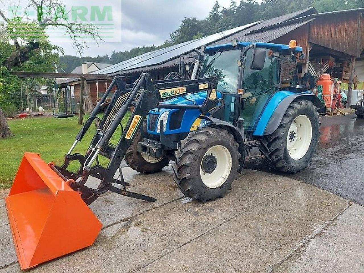 New Holland tl 90 a A - Tractor: foto 1 New Holland tl 90 a A - Tractor: foto 1
