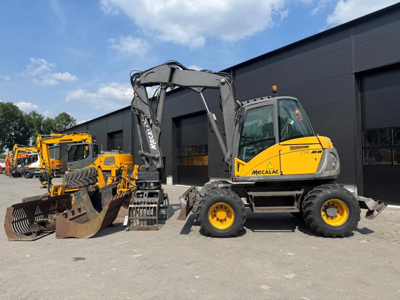 Mecalac 714MW FULL ATTACHMENTS OVERCOMPLEET !!! - Excavadora de ruedas: foto 1 Mecalac 714MW FULL ATTACHMENTS OVERCOMPLEET !!! - Excavadora de ruedas: foto 1