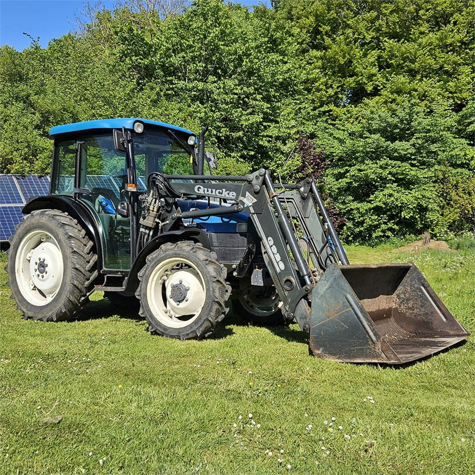 New Holland TN55D - Tractor: foto 1 New Holland TN55D - Tractor: foto 1