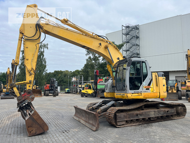 New Holland E235 - Excavadora de cadenas: foto 1 New Holland E235 - Excavadora de cadenas: foto 1
